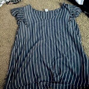 Blue and white short sleeve shirt with ruffle sleeves.